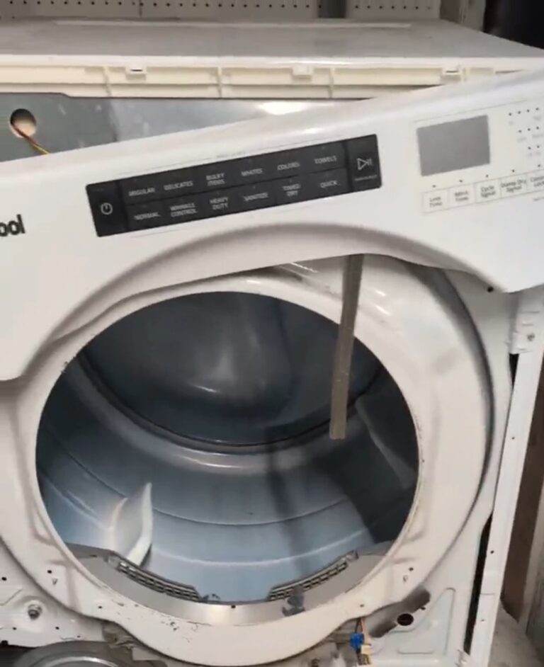 Front panel removed from a Whirlpool electric dryer to reach the heating element during an in-home repair in San Antonio